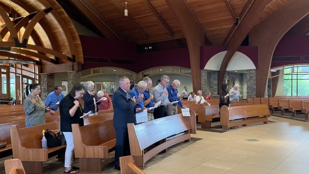 Community at prayer during Silver Rose Ceremony